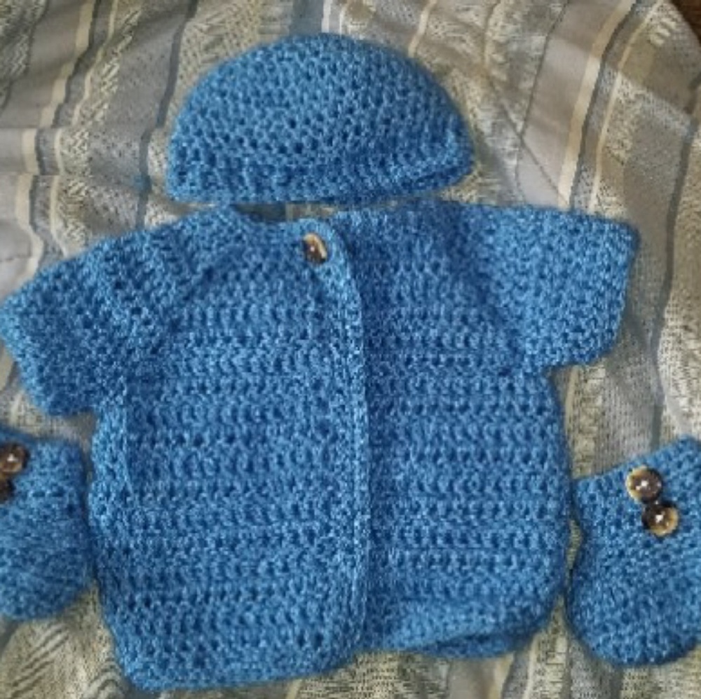 Hand crocheted baby outfit